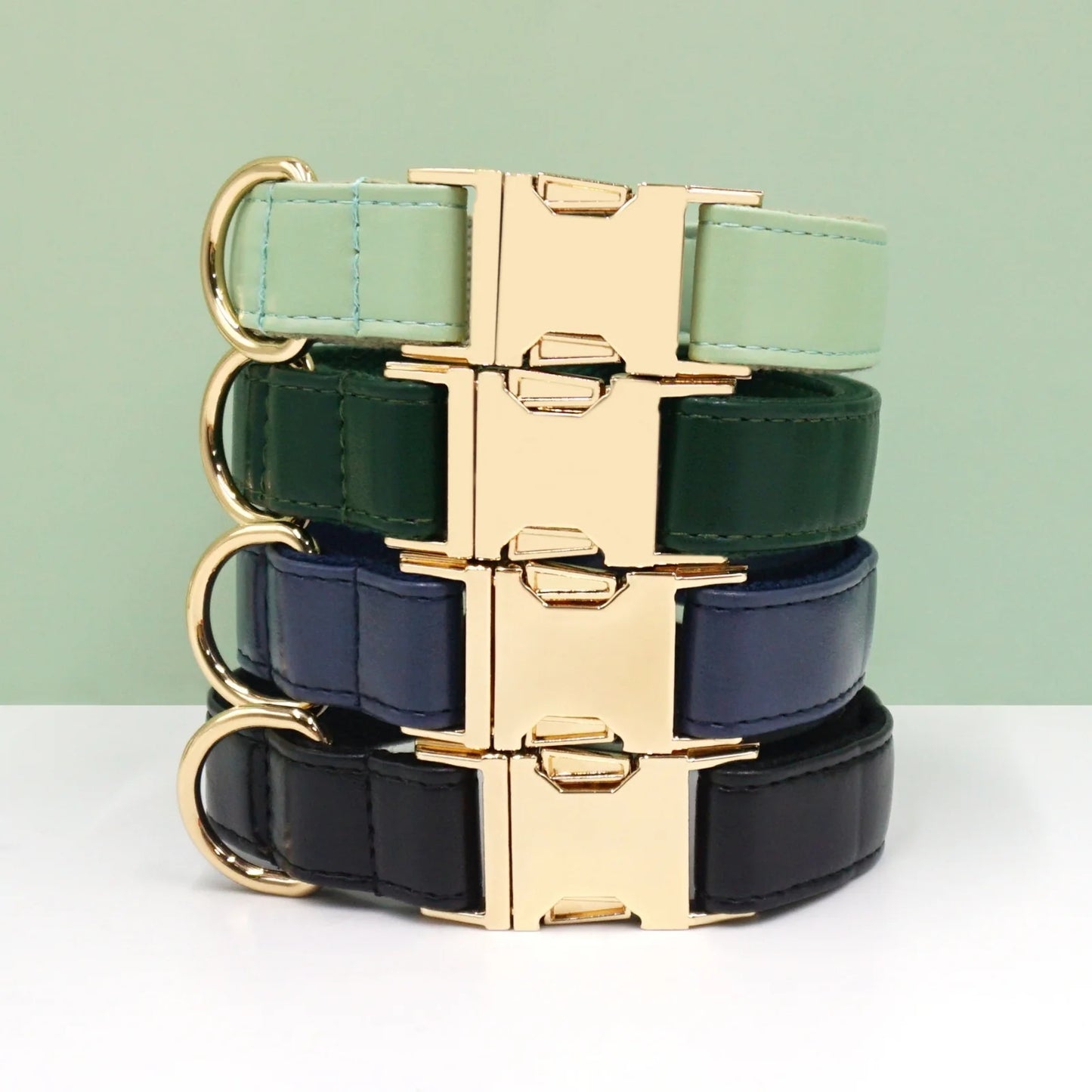 Stack of yellow, blue, and orange vivid leather dog collars