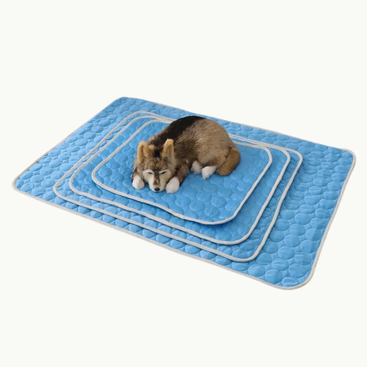 Dog sitting on ChillPaw blue pet cooling mats