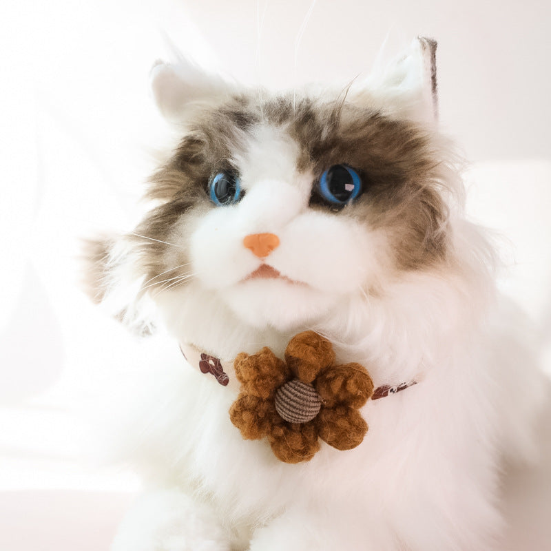 Cat wearing TeddyPaw Decorative Collar with cute brown flower accessory