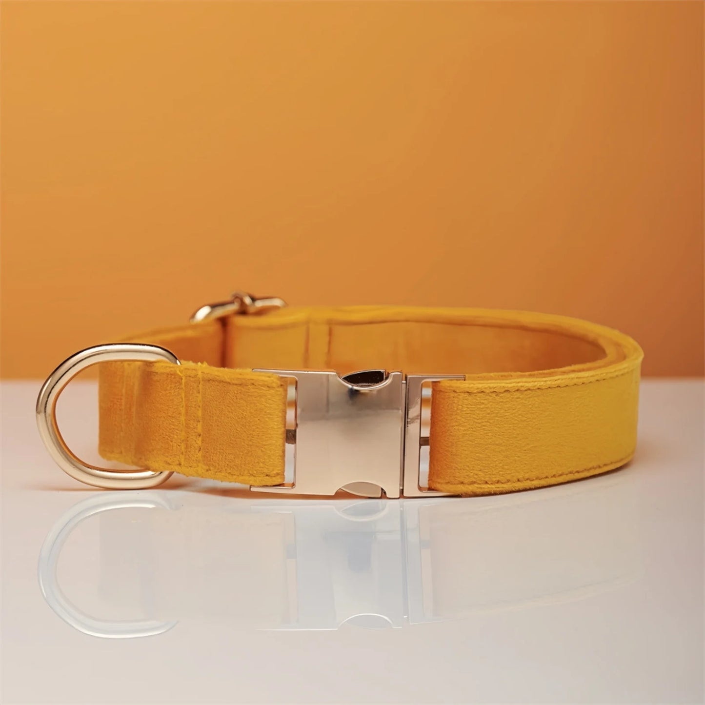 Stylish pastel yellow color dog collar displayed on table