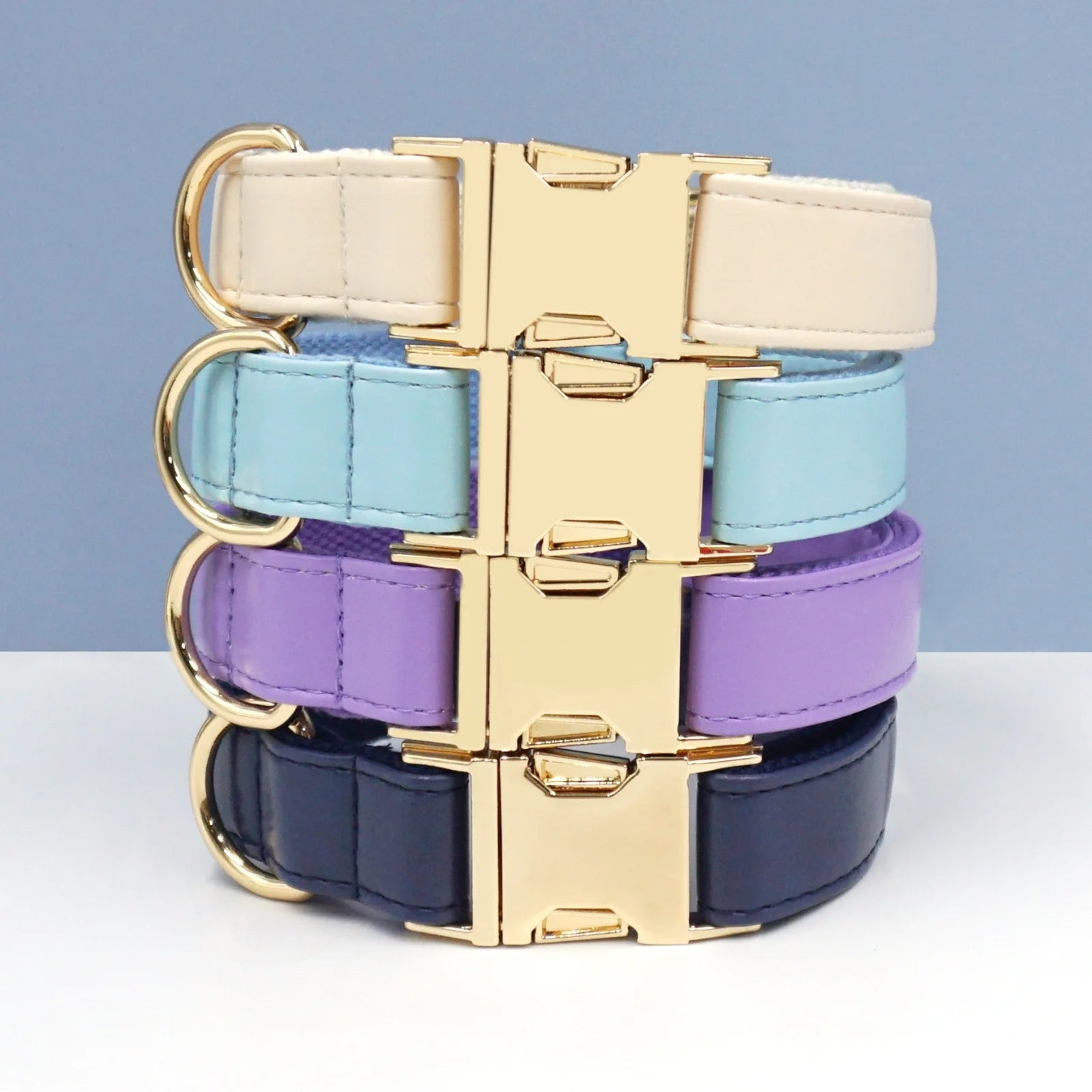 Multiple vivid dog collars stacked with premium leather design