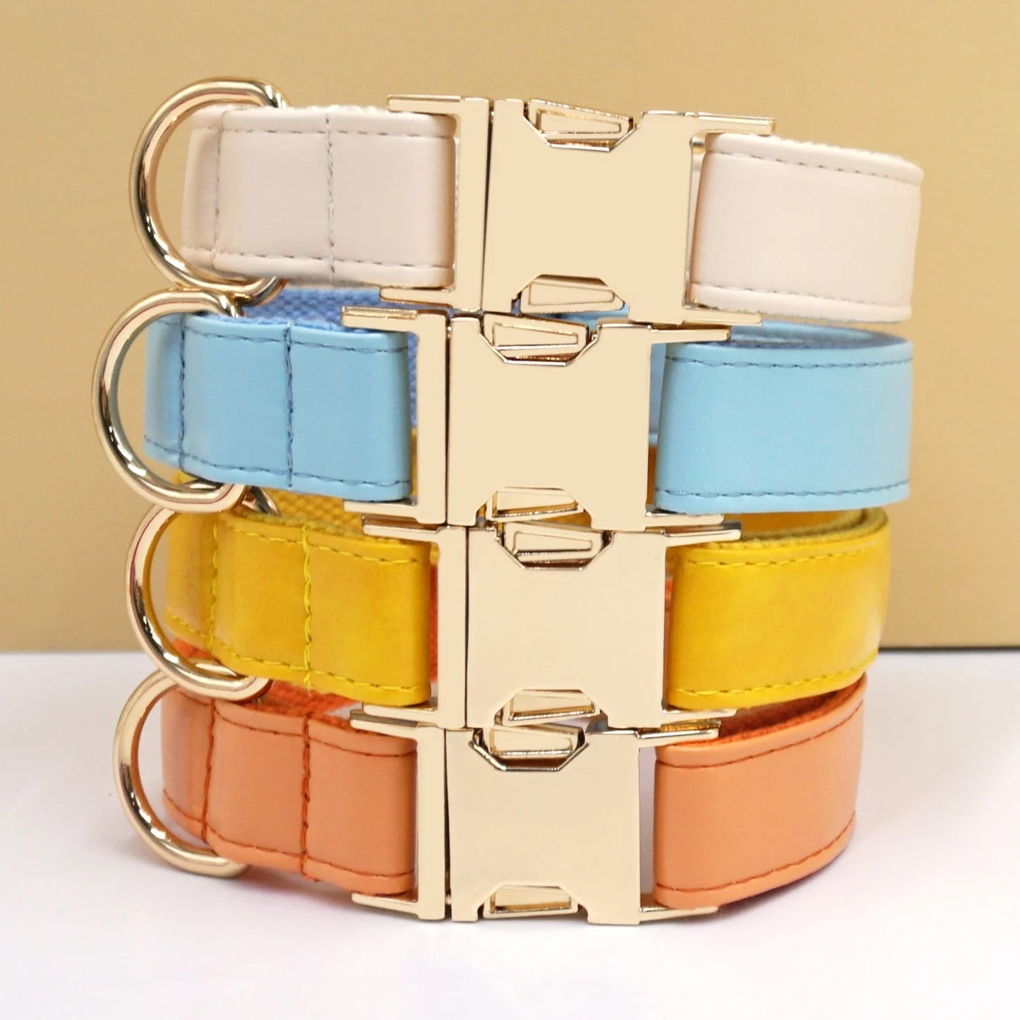 Stack of yellow, blue, and orange vivid leather dog collars