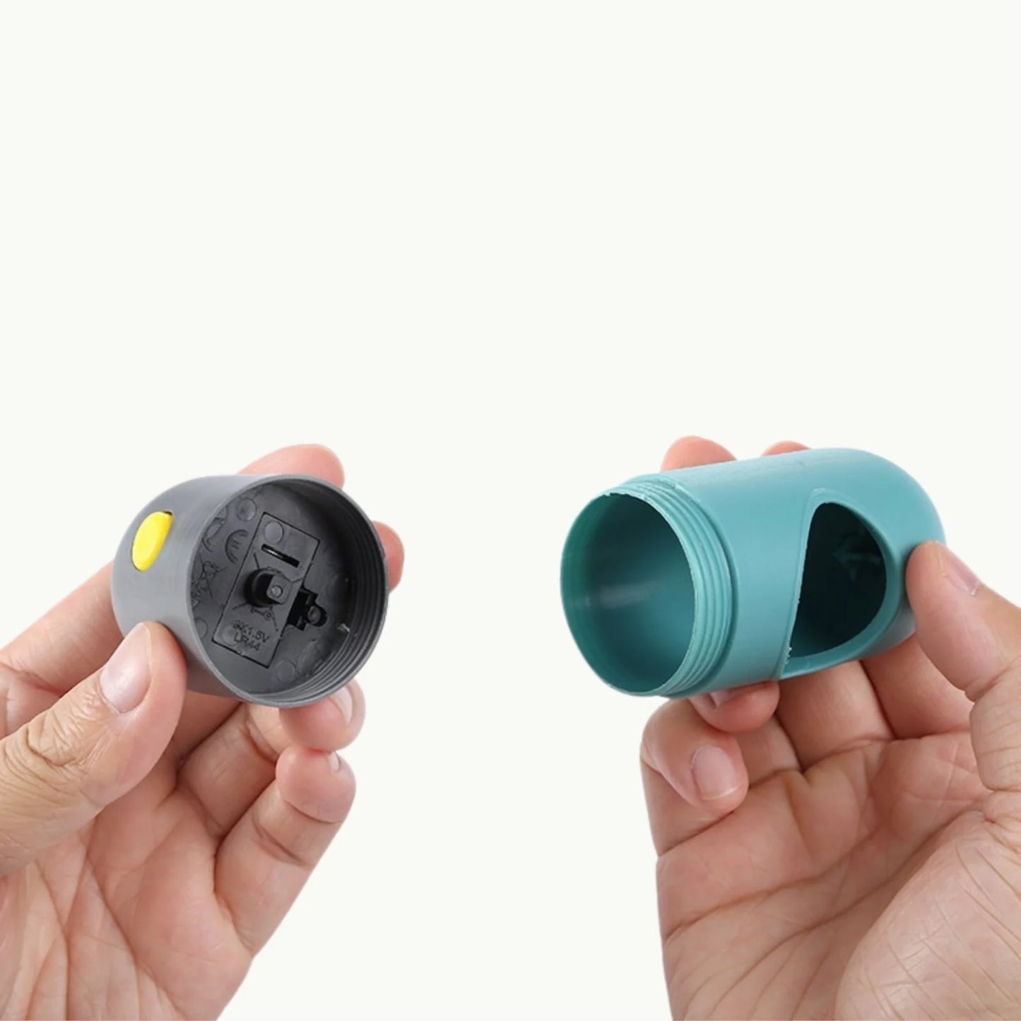 Hand holding LED pet waste bag dispenser for easy refilling