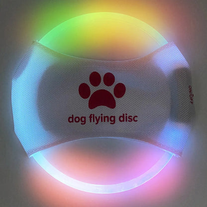 Colorful LookPaw™ rechargeable LED flying disc with paw design glowing