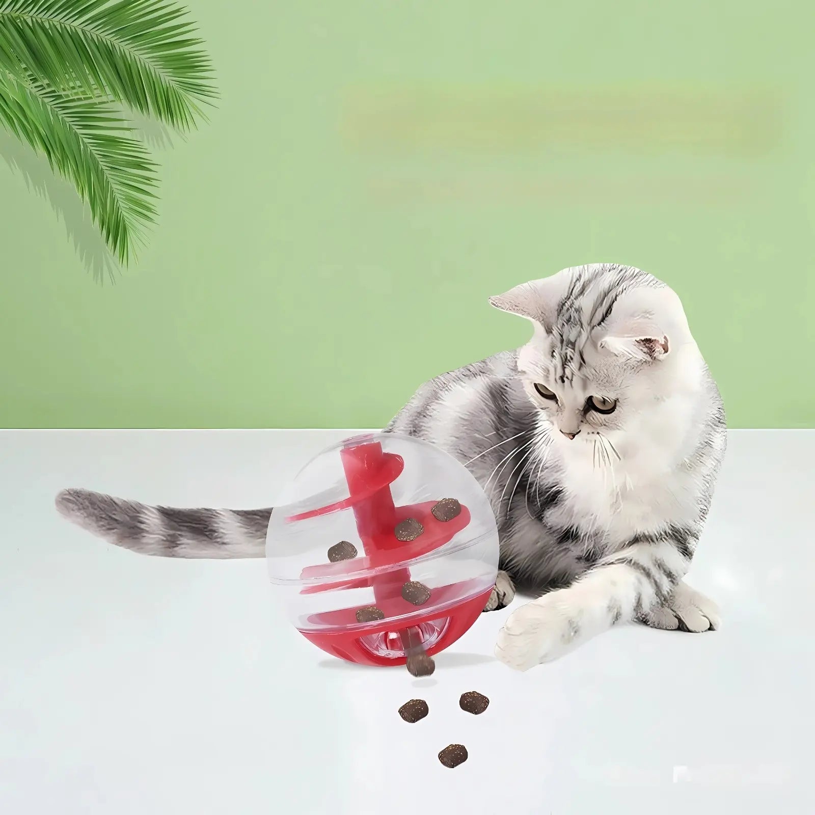 Cat playing with WhiskerMaze treat dispensing toy ball